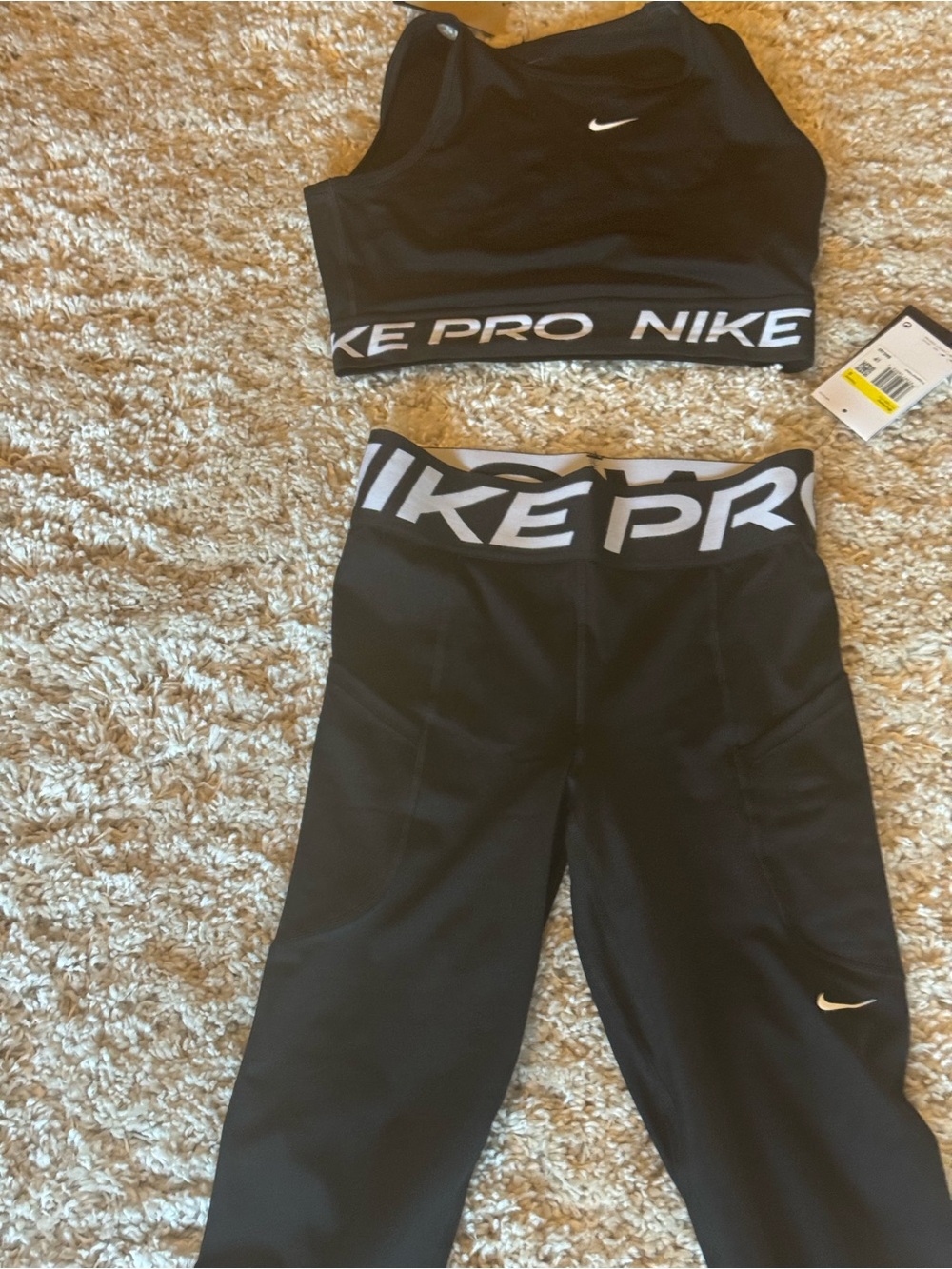 Nike Black Crop Sports Tank with White Swoosh and Branded Hem - Picture 4 of 4